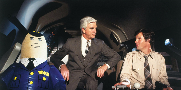 Surely these two ace airline pilots and Leslie Nielsen can solve their wireless issues (image courtesy of Paramount Pictures)